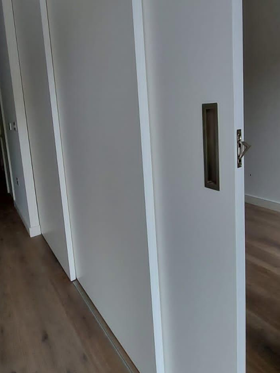 Solid panel sliding door room divider